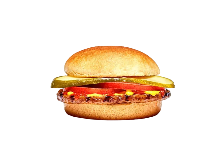 A classic burger with a golden-brown bun, a cooked beef patty topped with melted yellow cheese, a slice of red tomato, and a pickle spear, isolated on a solid black background.